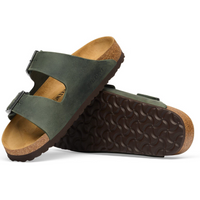 A pair of Birkenstock Arizona slide sandals in olive green suede with a brown cork footbed and dark brown textured outsole, shown on a white background.