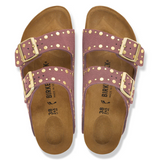A pair of Birke double-strap slide sandals in dusty mauve with gold-tone buckles and gold polka dot accents on the straps, shown from a top-down view on a white background.