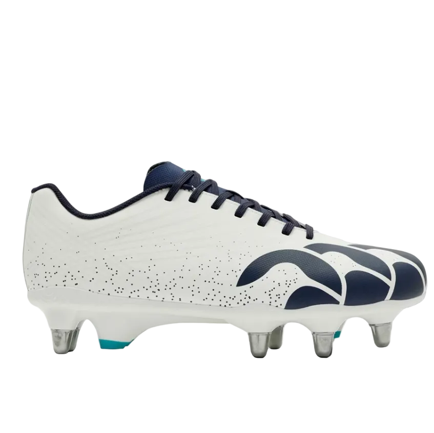 A white soccer cleat with navy blue accents, featuring a speckled pattern on the side, navy blue logo details, and metallic silver studs, shown against a plain white background.