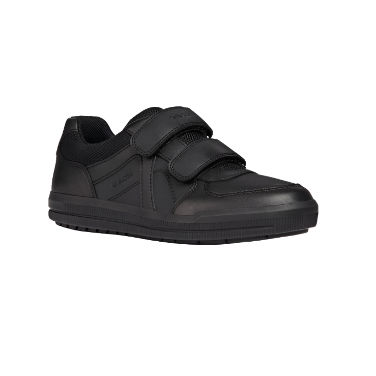 Black leather school shoe with double Velcro straps and textured rubber sole