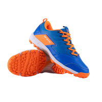 Blue and orange athletic shoe with textured sole and orange laces