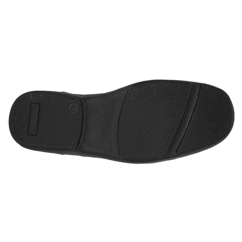 Textured black rubber shoe sole with grip pattern, photographed from below.