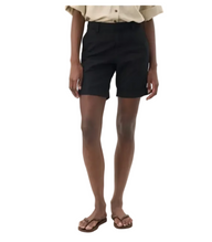 Person wearing black shorts on a white background