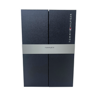Navy blue Tommy Hilfiger gift box with branding and silver sleeve reading 'A special gift for'.