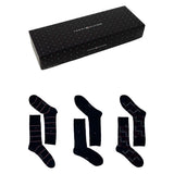 Gift box with three pairs of navy socks in striped, solid, and checked patterns.