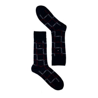 Pair of navy crew socks with red and white all-over text pattern on white background