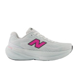 New Balance women's white and pink trainer